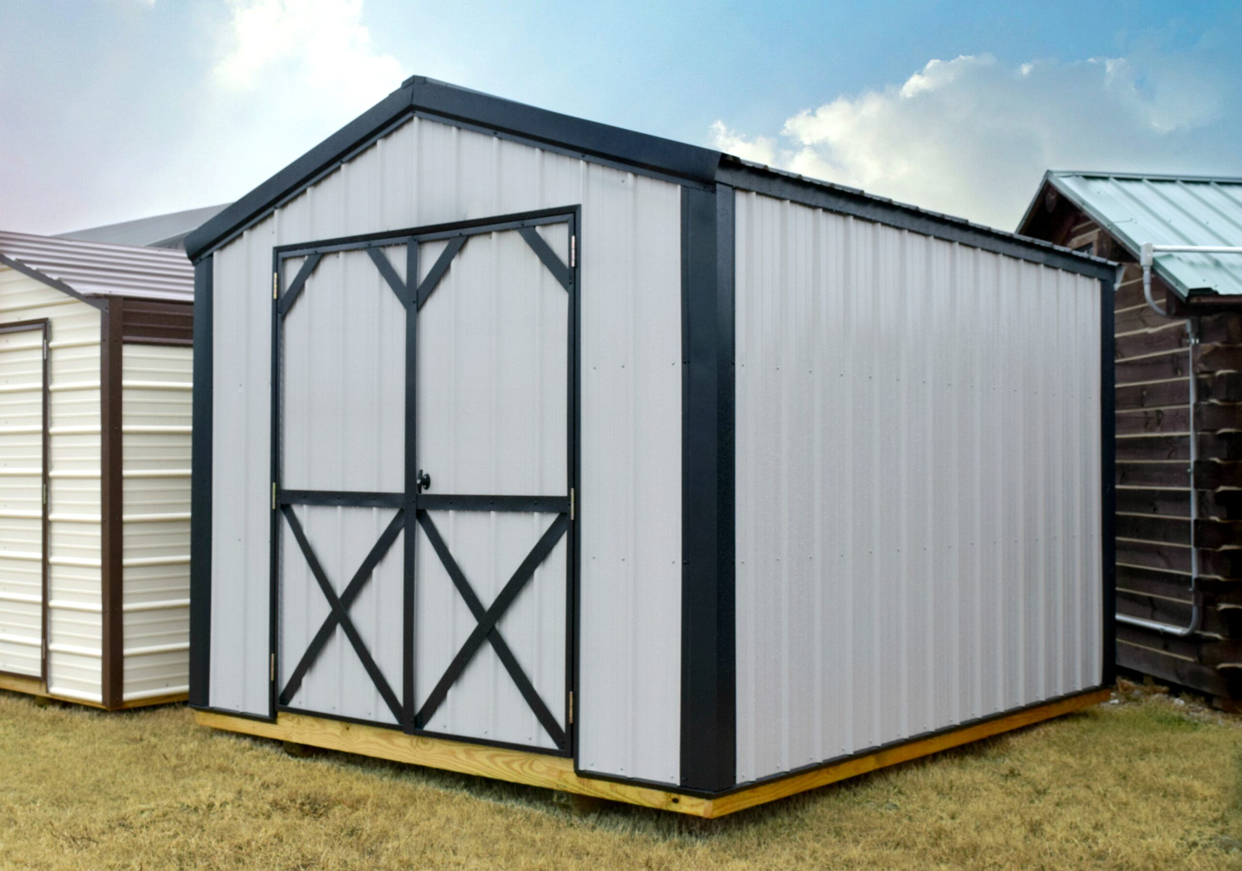 Gray metal shed with black trim and roof