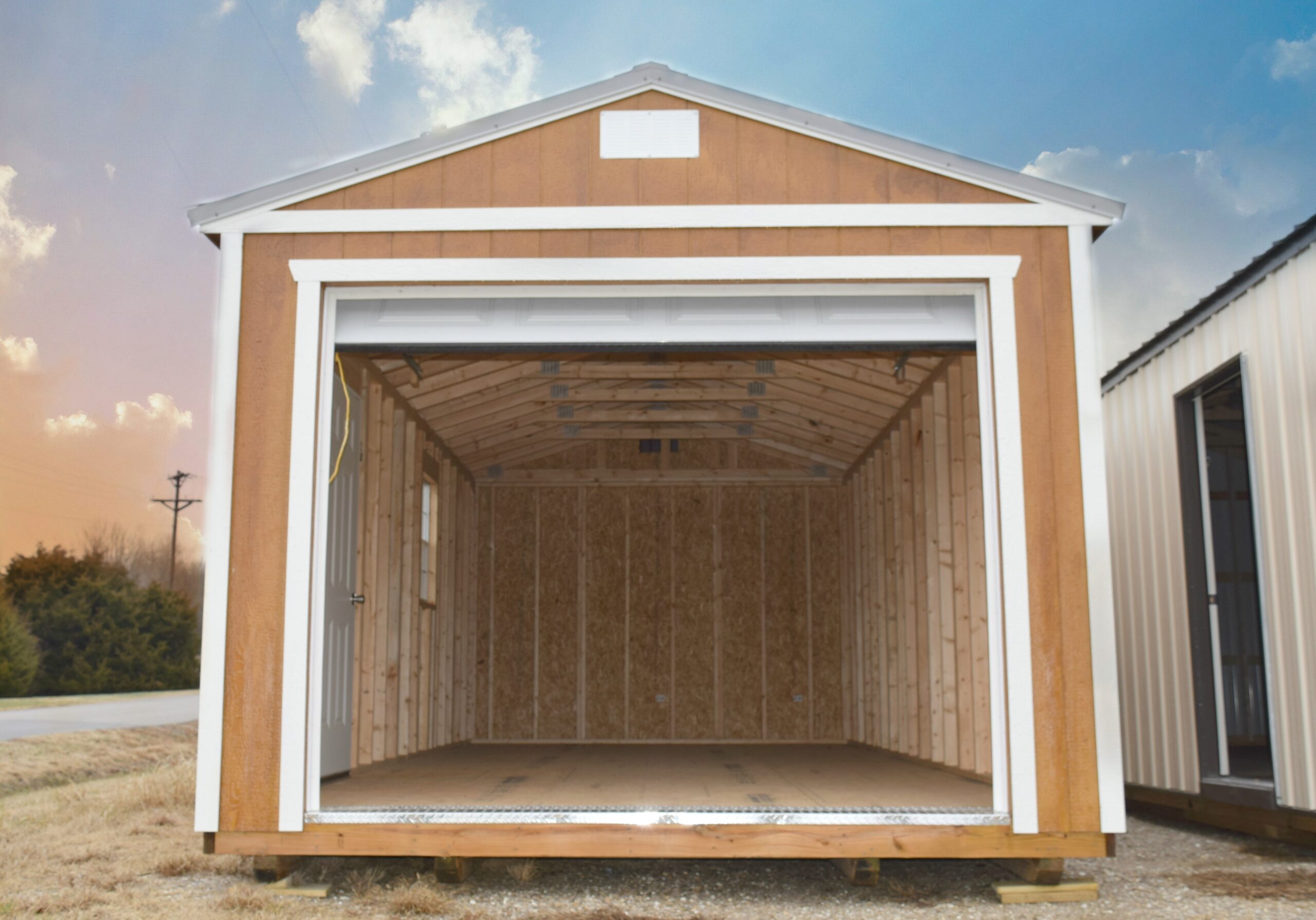 Open wood garage with white trim