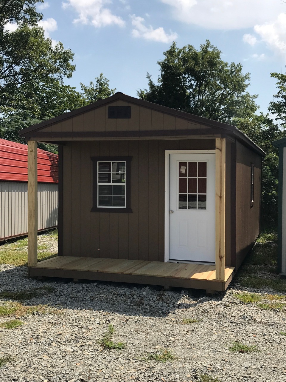 Brown express series cabin with black trim and white door