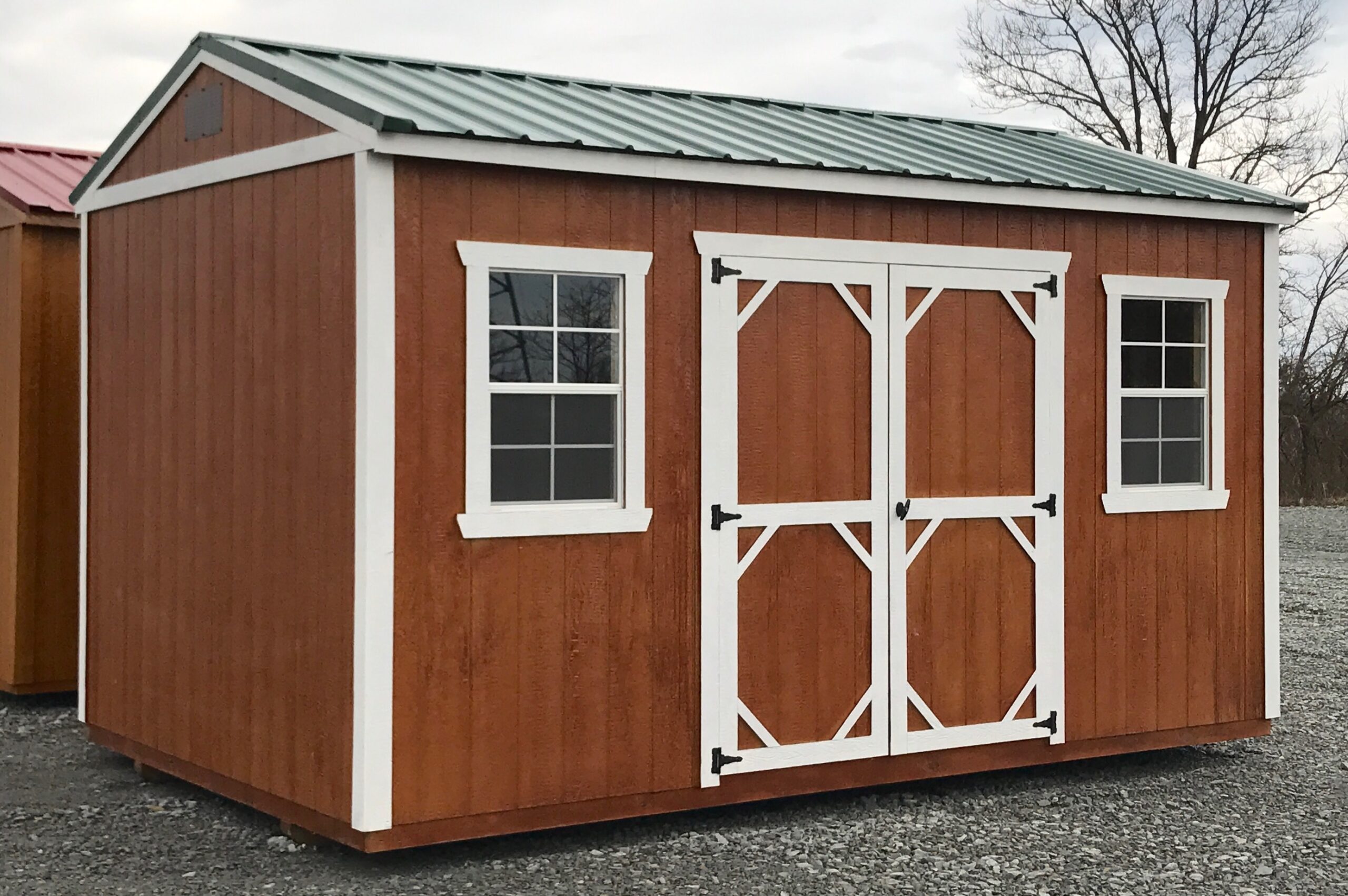 Brown urethane garden shed with white trim and dark roof